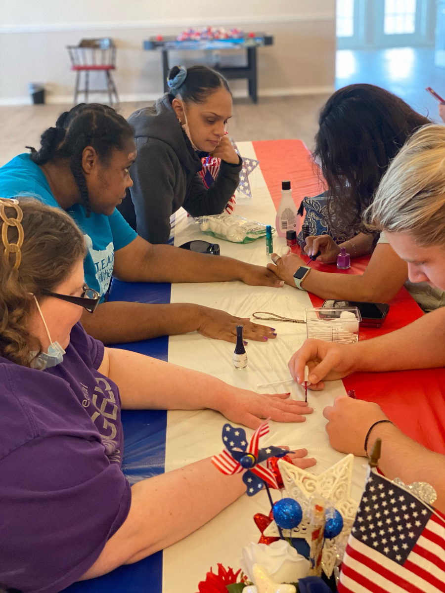 Caleb Johnston participating in a nail-painting activity at The Special Angels of The Woodlands.